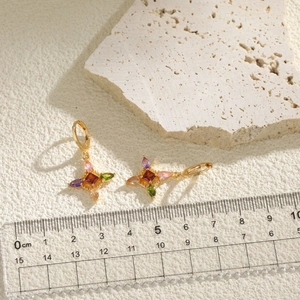 Golden clover-shaped earrings with colorful zirconia stones and vintage star motif