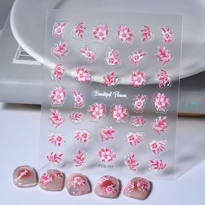 Macro shot of 5D embossed floral nail stickers with pink flowers and 3D leaf textures
