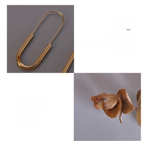 Detailed macro view of 18K gold-plated surgical titanium safety pin earrings for women