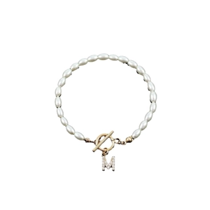 Retro faux pearl bracelet with gold OT toggle clasp and crystal letter M pendant