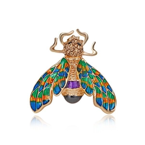Macro detail of insect brooch with colorful enamel wings and sparkling rhinestones