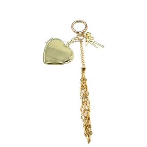 Golden heart locket keychain with pink bow and metallic tassel on white background