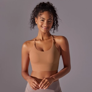 Close-up of seamless nude yoga sports bra with wide straps and high-elastic ribbed hem