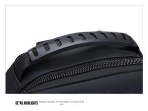 Detail shot of ergonomic rubber handle and durable metal zippers on black oxford chest bag