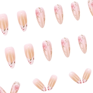 Almond shaped press-on nails featuring pink watercolor rose designs and French gradient finish