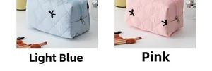 Set di pochette per trucco trapuntate in azzurro e rosa con ricamo a fiocco e cerniera