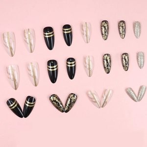 Luxury dark almond press-on nails with black gold fluid marble and glitter design