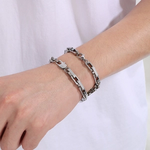 Unisex stainless steel cuboid link bracelet with polished silver finish on wrist