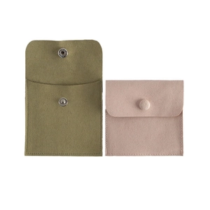 Velvet jewelry storage pouches in army green and pink with snap button closure