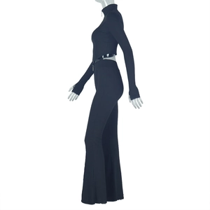 Side view of black ribbed knit two-piece set with zip crop top and high waist flared pants