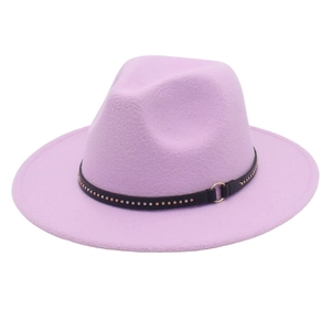 Detail of purple felt fedora with black leather band, metal studs and gold ring buckle