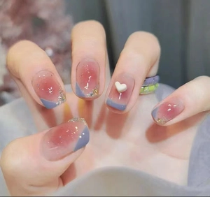 Pink blush press-on nails with blue French tips, silver glitter and white 3D heart