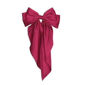 Deep rose red satin bow hair clip with long streamers and a silky smooth finish