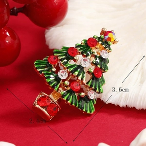 Exquisite hollow Christmas tree brooch with green enamel and sparkling red rhinestones