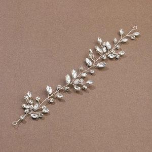 Detailed view of silver vine bridal hairpiece with marquise rhinestones and crystals