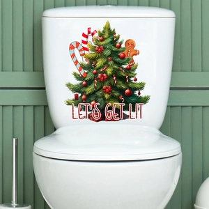 Detail of waterproof Christmas toilet sticker with tree and gingerbread man on white tank