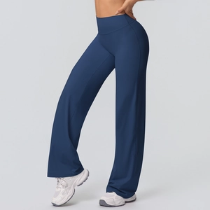 Detail of high-waisted navy blue wide leg yoga pants featuring a slimming fit and soft texture