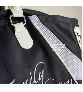 Close-up of bowling bag featuring embroidery number 5 and white mesh stitching details