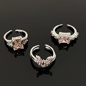Luxury butterfly zircon ring set with silver adjustable bands on black mirror background