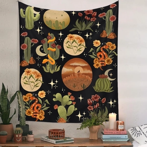 Detail view of bohemian desert tapestry with cactus and moon on white wall