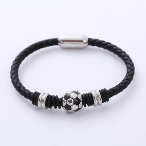 Detail of a woven leather sports bracelet with a soccer bead and magnetic clasp