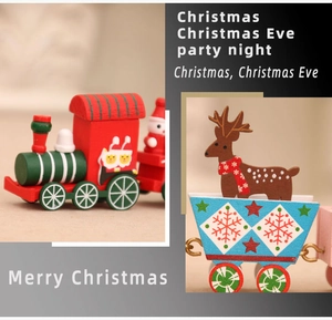 Detail of red and green wooden Christmas train with reindeer and festive patterns