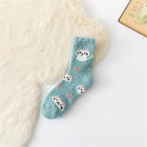 Close-up of blue coral fleece winter sock featuring cute cat and pink heart patterns