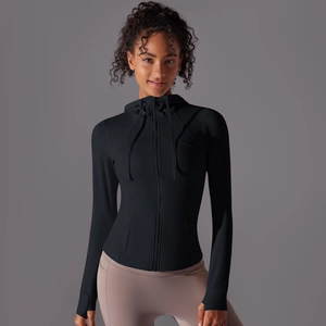 Close-up of black slim fit hooded sports jacket with thumb holes and zipper detail