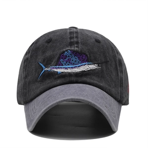 Detail of sailfish embroidery on dark grey washed cotton outdoor baseball cap