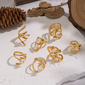 Detailed collection of 18K gold plated stainless steel rings with zircon on natural stone