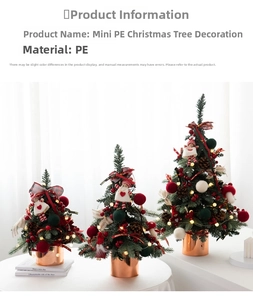 Three sizes of mini PE Christmas trees with red berries and rose gold pots on desk
