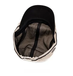 Detail of British herringbone flat cap with elastic band and internal black lining