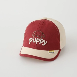 Close-up of cute puppy embroidery and premium stitching on red and white kids baseball cap