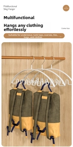 Detail of white wave-shaped multi-functional hanger holding bags in a wooden wardrobe