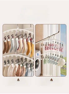 Close-up of multi-clip children's clothes hanger with metal spring clips for space saving