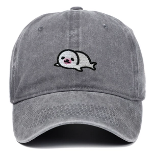Detailed close-up of a cute seal embroidery on a vintage grey washed cotton baseball cap