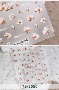 Detailed macro view of TS-3056 floral nail stickers with pink flowers on a textured sheet
