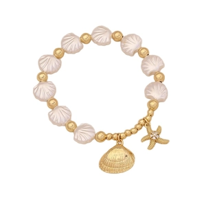 Beaded ocean bracelet featuring pearl shells, golden starfish and shell charms in 18K gold