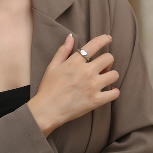 Minimalist silver heart ring for women shown on hand for a stylish office look
