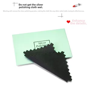 Soft cotton silver cleaning cloth with serrated edges and green packaging envelope