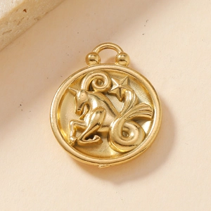 Macro view of 18K gold stainless steel Capricorn zodiac pendant with detailed relief