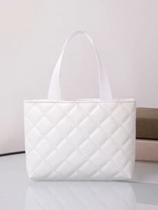 Close-up of white quilted PU leather tote bag with elegant weave texture and strap detail