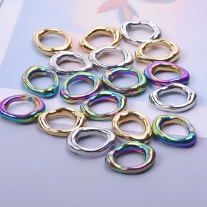 Macro shot of oval 304 stainless steel jewelry connectors in gold, silver and rainbow colors