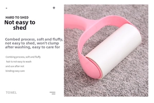 Pink lint roller cleaning grey bamboo charcoal fiber towel showing hair removal detail