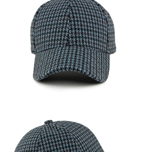 Detail of houndstooth baseball cap in blue and brown knit fabric for autumn and winter