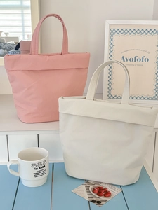 Minimalist macaron-style puffy tote bag in pink and cream white with rolled edge design