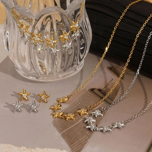 Star-shaped zircon necklace and earrings set in gold and silver plating finish