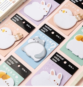 Detailed view of standing animal-shaped sticky notes with cute rabbit and cat designs