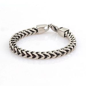 Men's stainless steel wheat chain bracelet with a heavy-duty metal clasp on white background