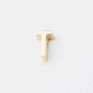 Macro shot of mirror-polished gold-plated stainless steel letter T bead with a 1.8mm hole